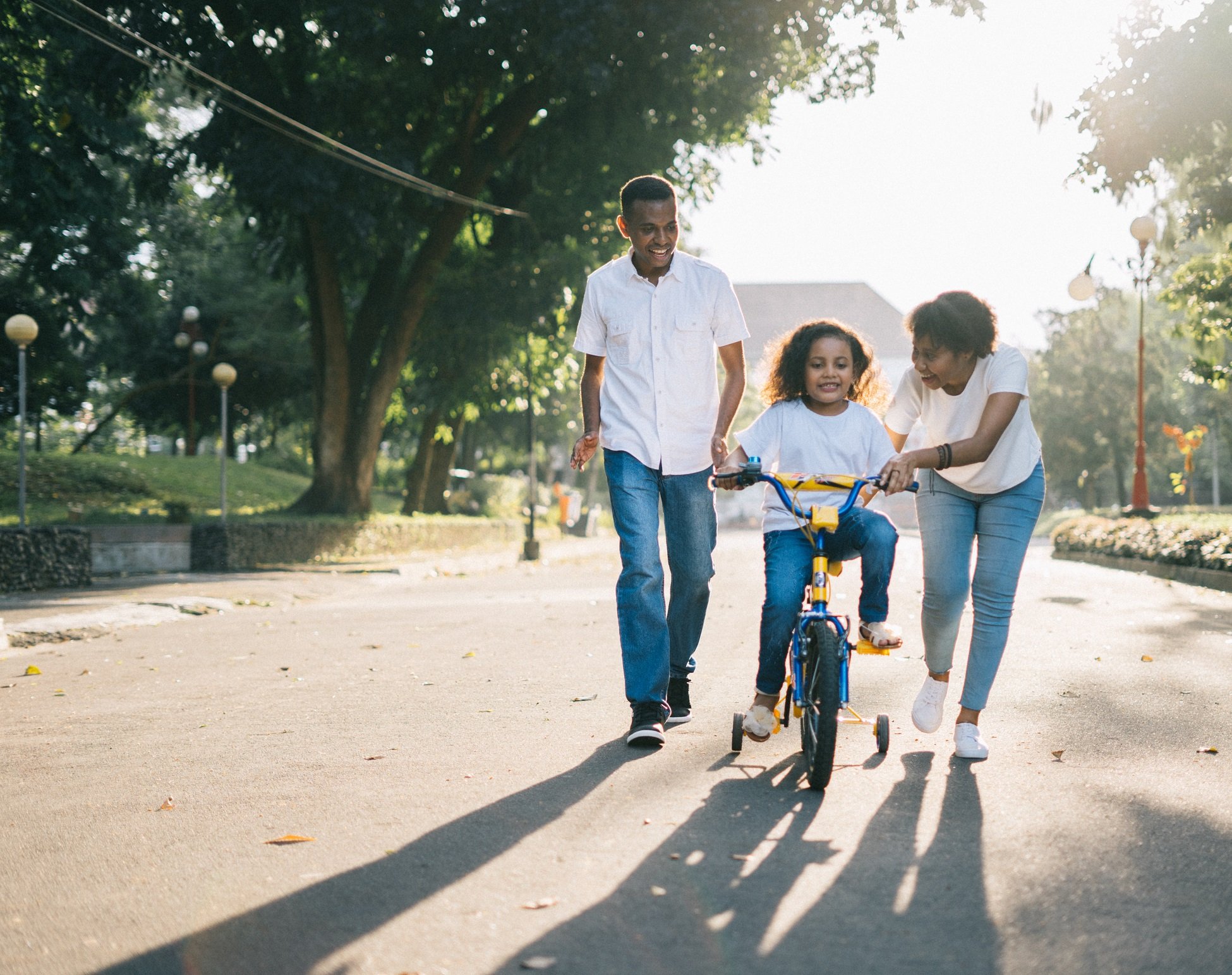A family standing together outside their home